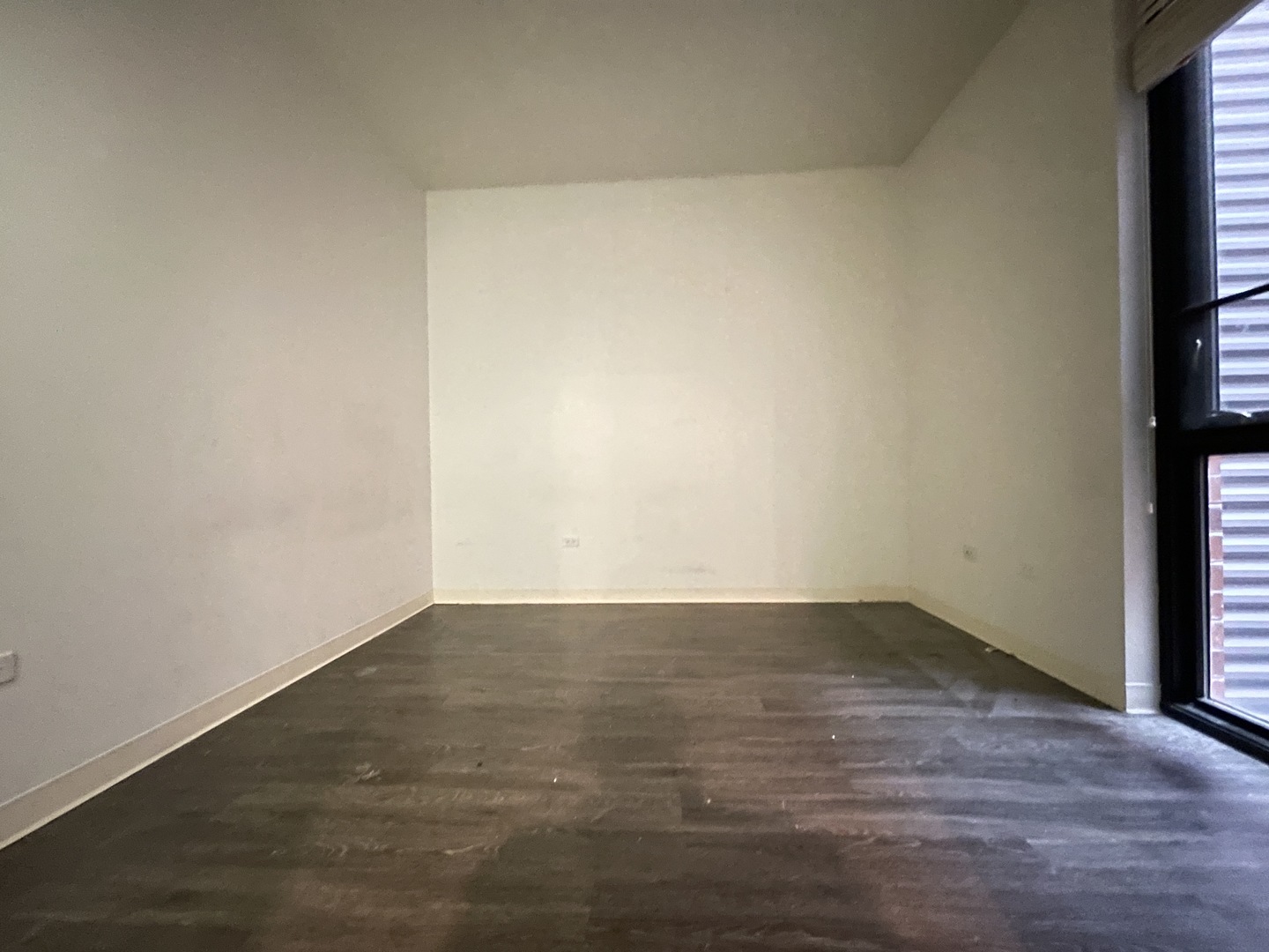 Undisclosed Address Chicago, IL 60642 - Photo 22 of 25 an empty room with wooden floor and windows