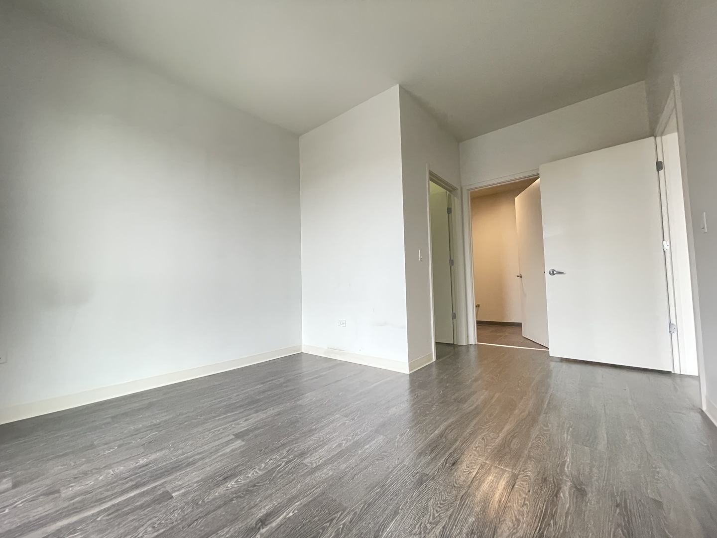 Undisclosed Address Chicago, IL 60642 - Photo 9 of 25 a view of an empty room and wooden floor