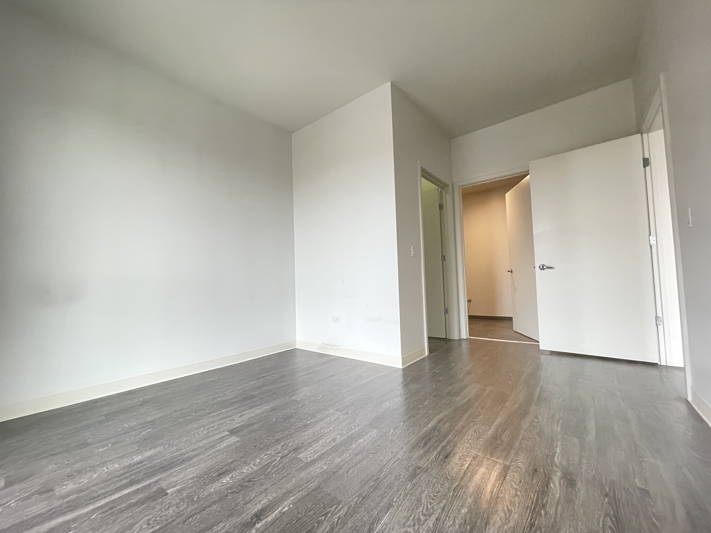 Undisclosed Address Chicago, IL 60642 - Photo 10 of 25 a view of an empty room and wooden floor