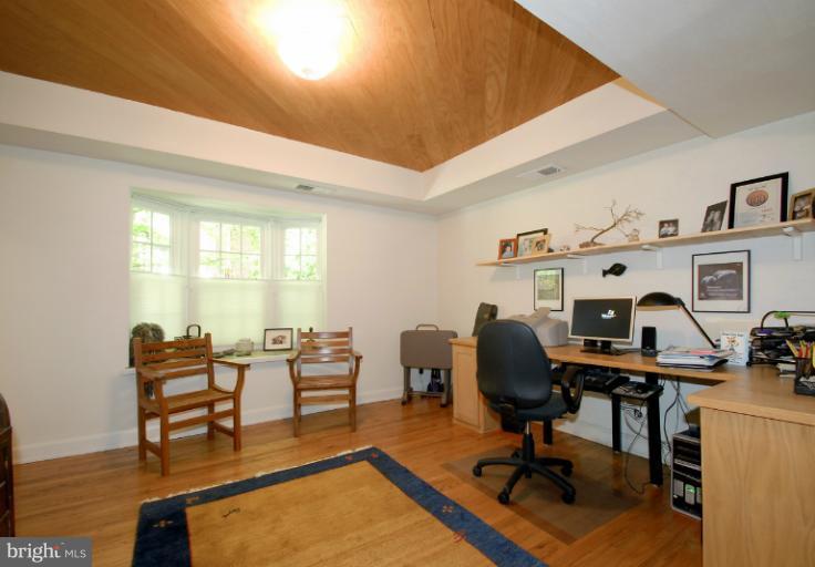 8655 Geren Road, Unit 272 Silver Spring, MD 20901 - Photo 5 of 11 a view of a livingroom with workspace and a couch