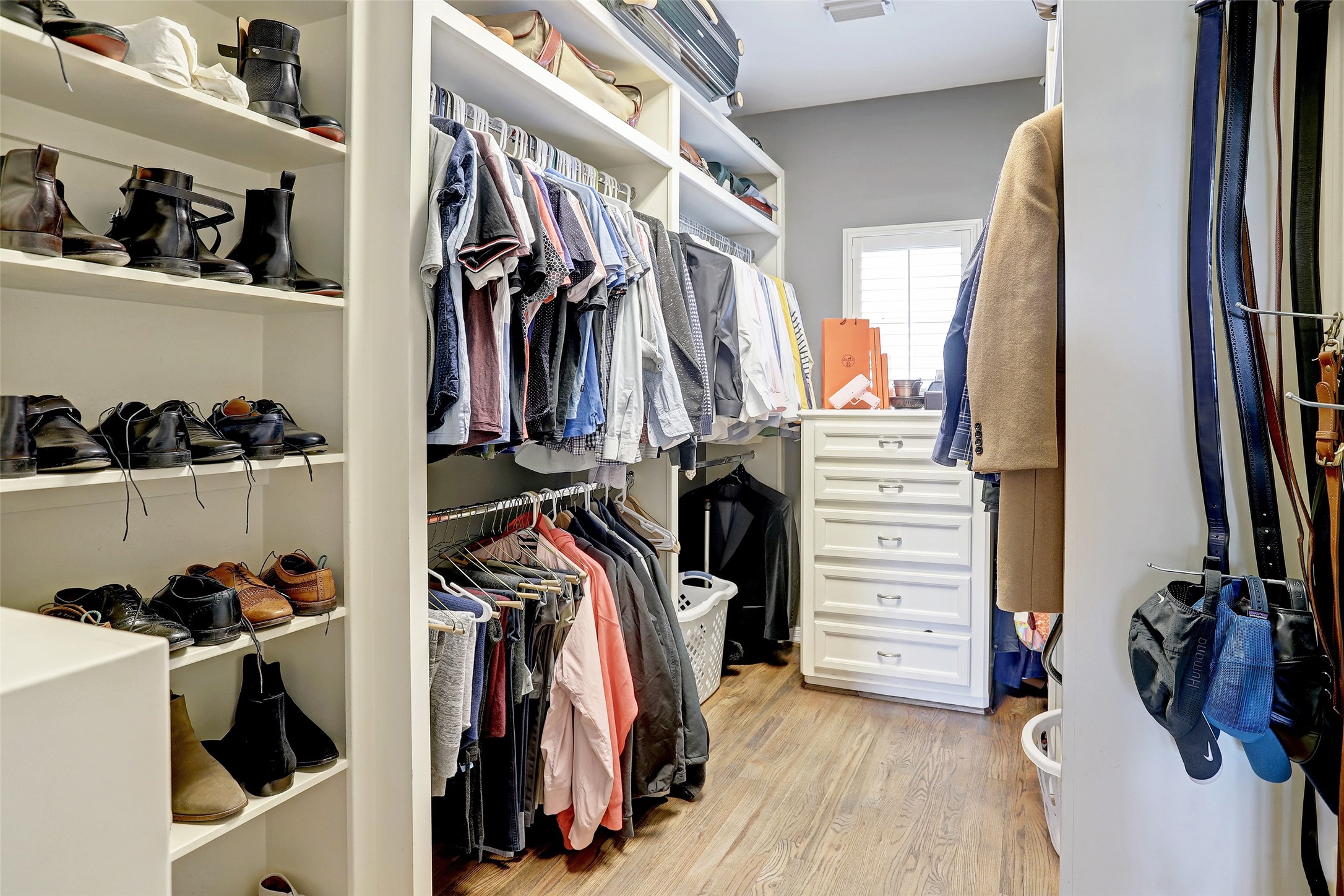 2810 Helena Street Houston, TX 77006 - Photo 14 of 16 a view of walk in closet with clothes and shoes