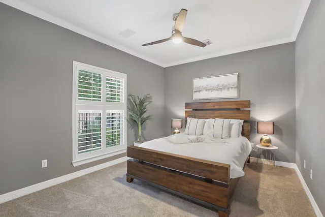 a spacious bedroom with a bed and a window