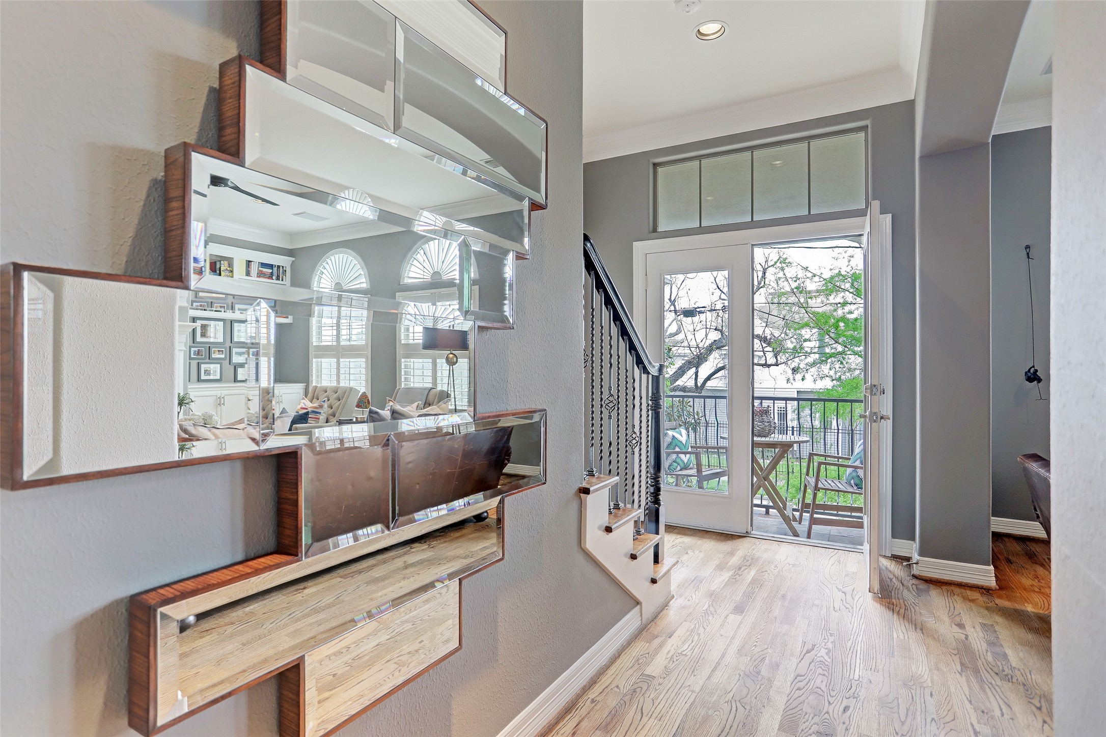 2810 Helena Street Houston, TX 77006 - Photo 5 of 16 a living room with furniture a flat screen tv and a floor to ceiling window