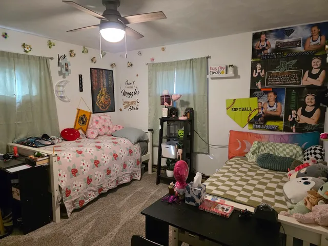 a bedroom with bed and a window