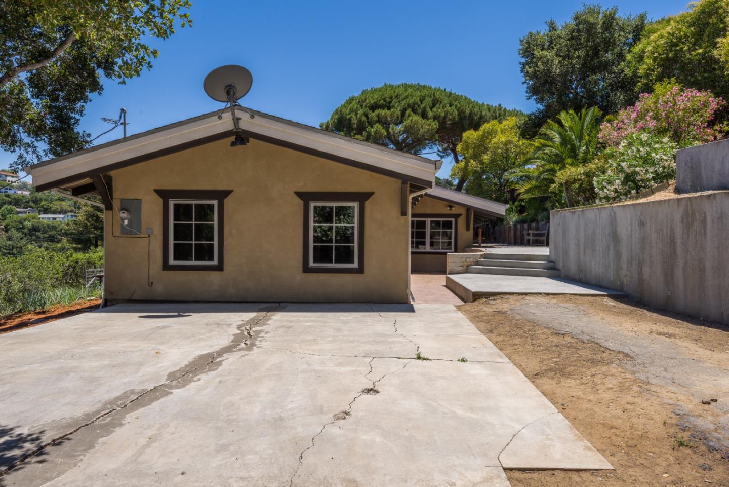 248 Exeter Avenue San Carlos, CA 94070 - Photo 22 of 28 a front view of a house with a yard and garage