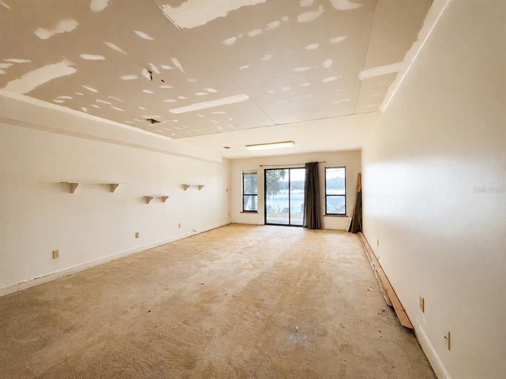 7119 Immokalee Road Keystone Heights, FL 32656 - Photo 34 of 50 wooden floor in an empty room
