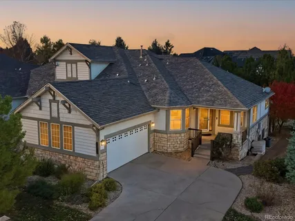 a aerial view of a house with a yard