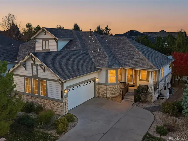 a aerial view of a house with a yard