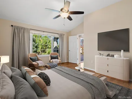 a bedroom with a bed and flat screen tv
