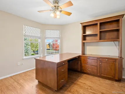a kitchen with a sink window and cabinets