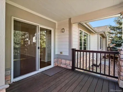 a view of a porch with wooden floor and outdoor space