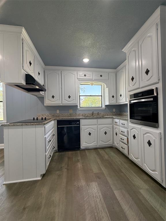 229 Travis Lane Hewitt, TX 76643 - Photo 14 of 17 a large kitchen with cabinets