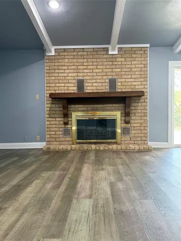 an empty room with a fireplace