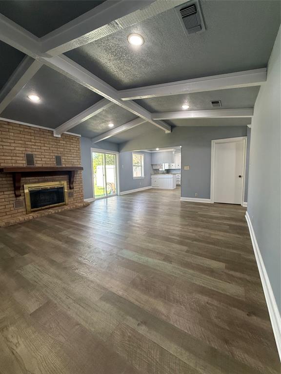 229 Travis Lane Hewitt, TX 76643 - Photo 6 of 17 a room with wooden floor and fireplace