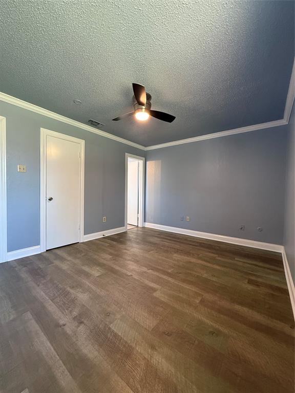 229 Travis Lane Hewitt, TX 76643 - Photo 9 of 17 a view of an empty room with ceiling fan and window