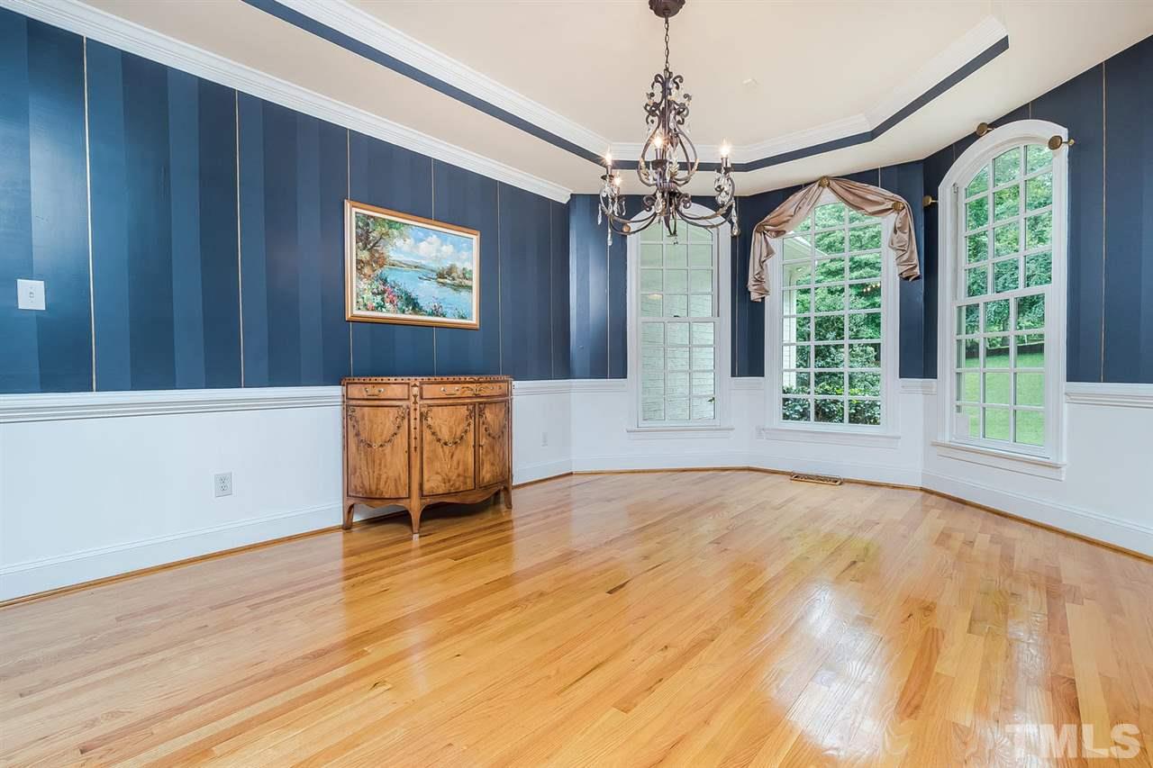 1105 Wagon Ridge Road Raleigh, NC 27614 - Photo 4 of 25 Formal Dining Room with Tray Ceiling and Glass French door to hallway.