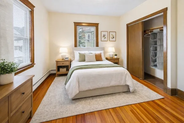 a bedroom with a bed and window