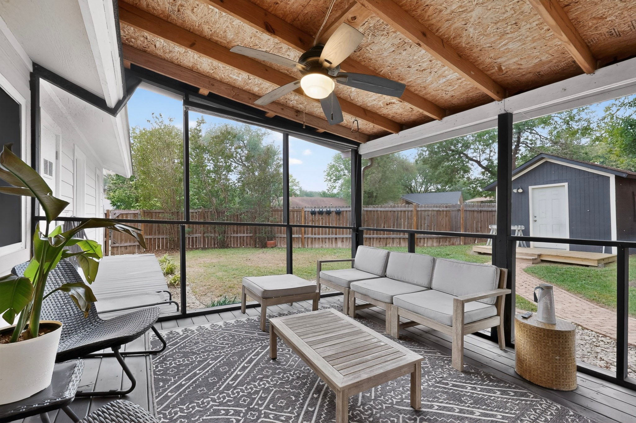 5541 Pine Place Austin, TX 78744 - Photo 28 of 33 Screened-in porch featuring a natural wood ceiling, ceiling fan, and composite decking