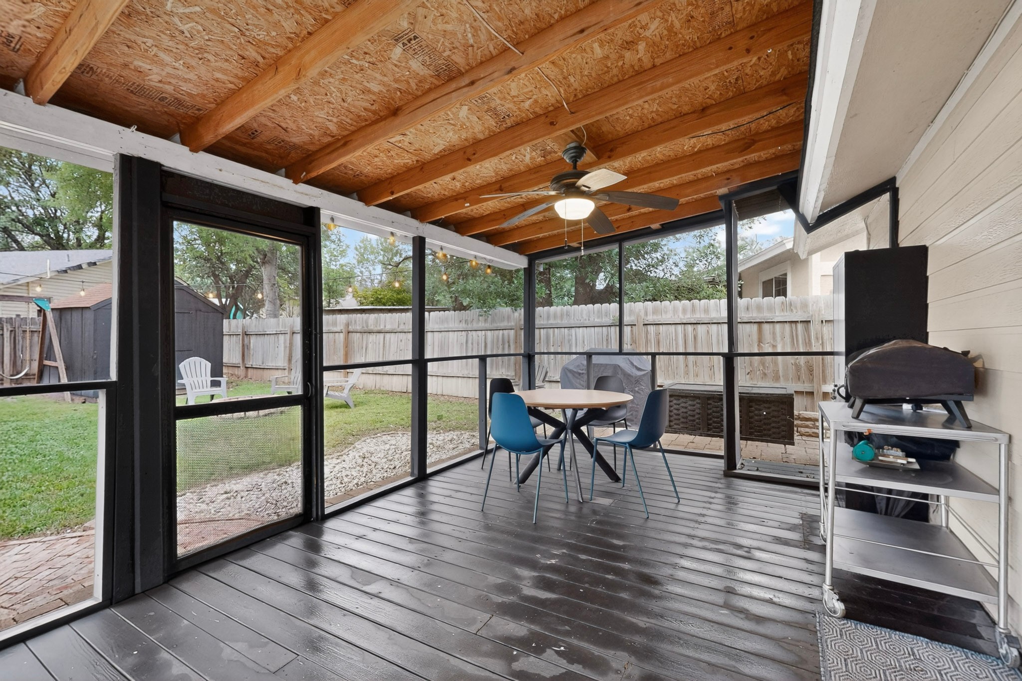 5541 Pine Place Austin, TX 78744 - Photo 30 of 33 Screened-in porch featuring a wood-finish ceiling, exposed beams, and a ceiling fan