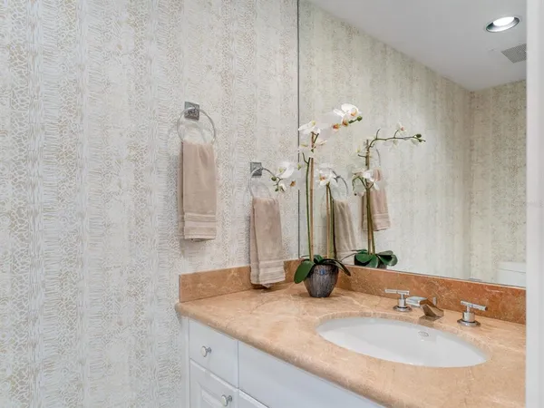 a bedroom with a bed and a chair