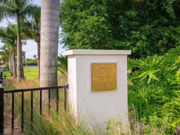 a view of swimming pool with outdoor seating and city view