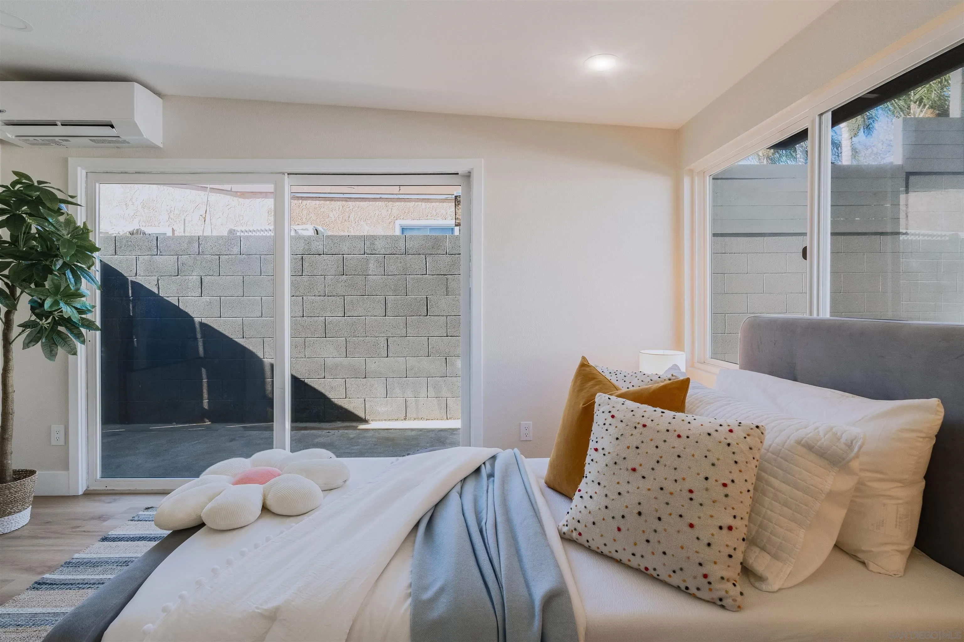 1426 Santa Rosa Street Oceanside, CA 92058 - Photo 47 of 73 a bedroom with furniture and a potted plant