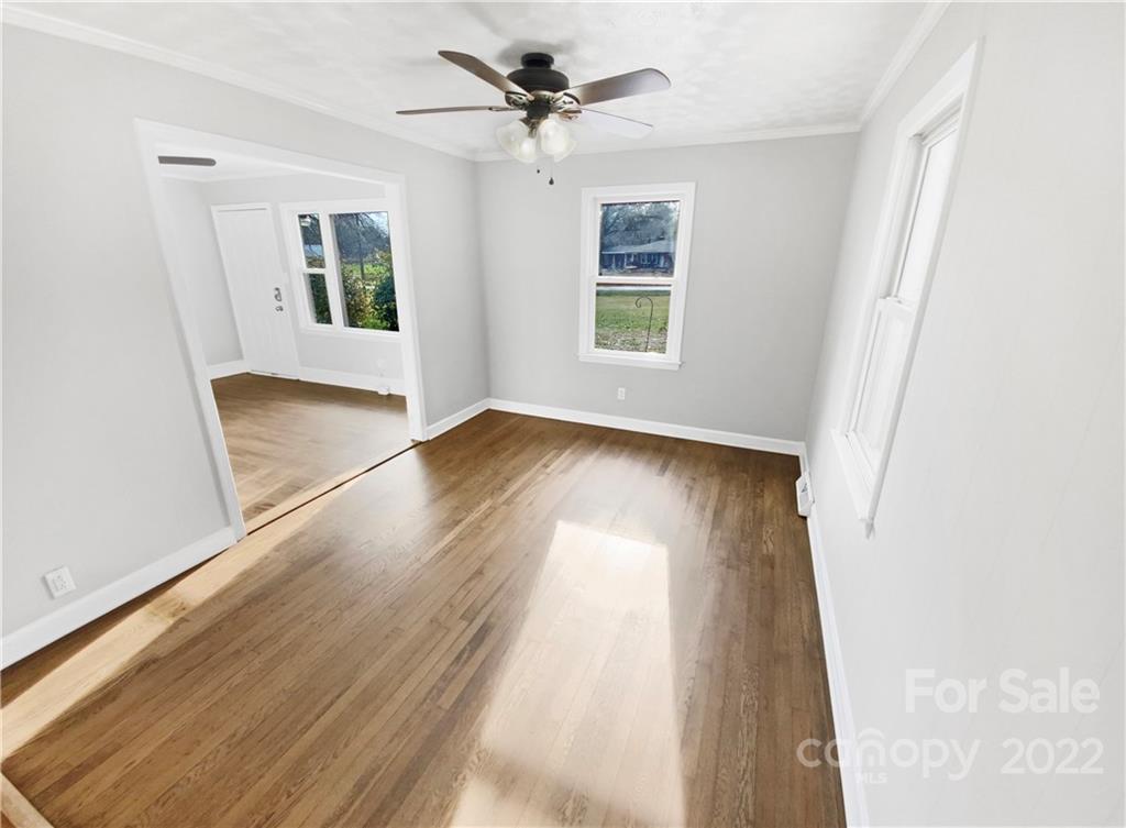 4408 Griffith Road Monroe, NC 28112 - Photo 11 of 17 wooden floor in an empty room with a window