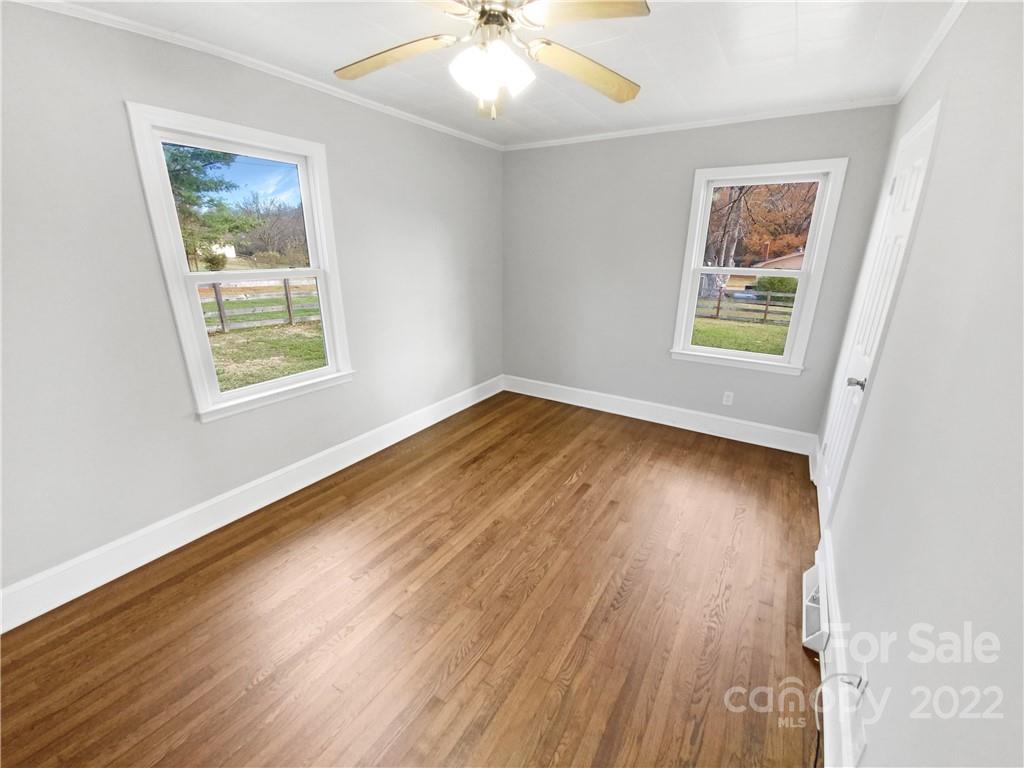 4408 Griffith Road Monroe, NC 28112 - Photo 13 of 17 a view of an empty room with wooden floor and a window