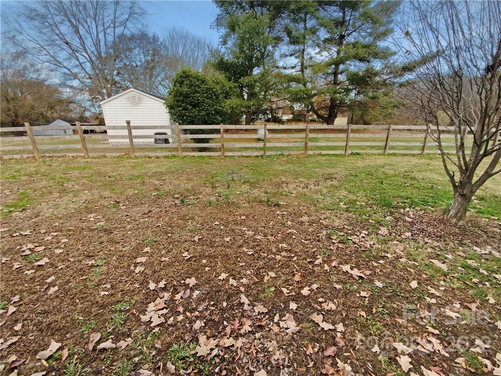 4408 Griffith Road Monroe, NC 28112 - Photo 17 of 17 a large building with trees in the background
