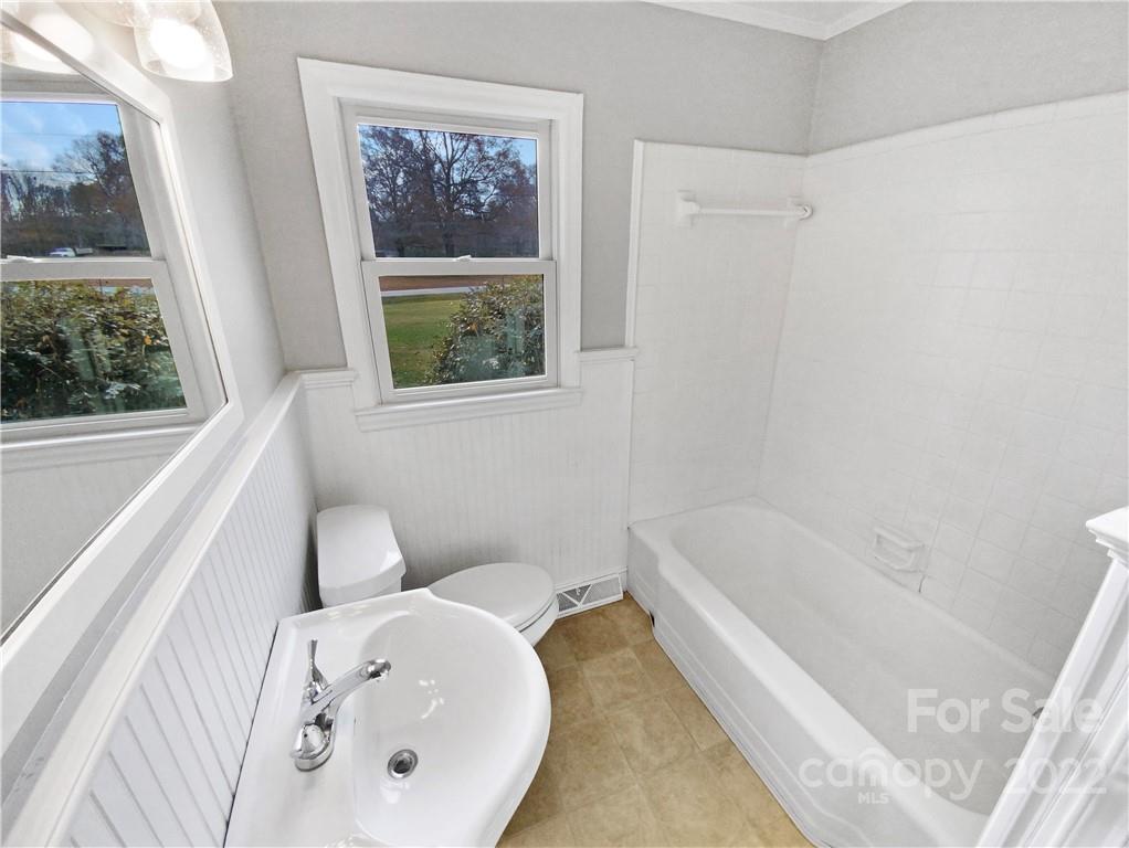 4408 Griffith Road Monroe, NC 28112 - Photo 7 of 17 a bathroom with a bathtub and a shower