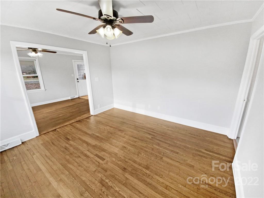 4408 Griffith Road Monroe, NC 28112 - Photo 9 of 17 a view of empty room with wooden floor and fan
