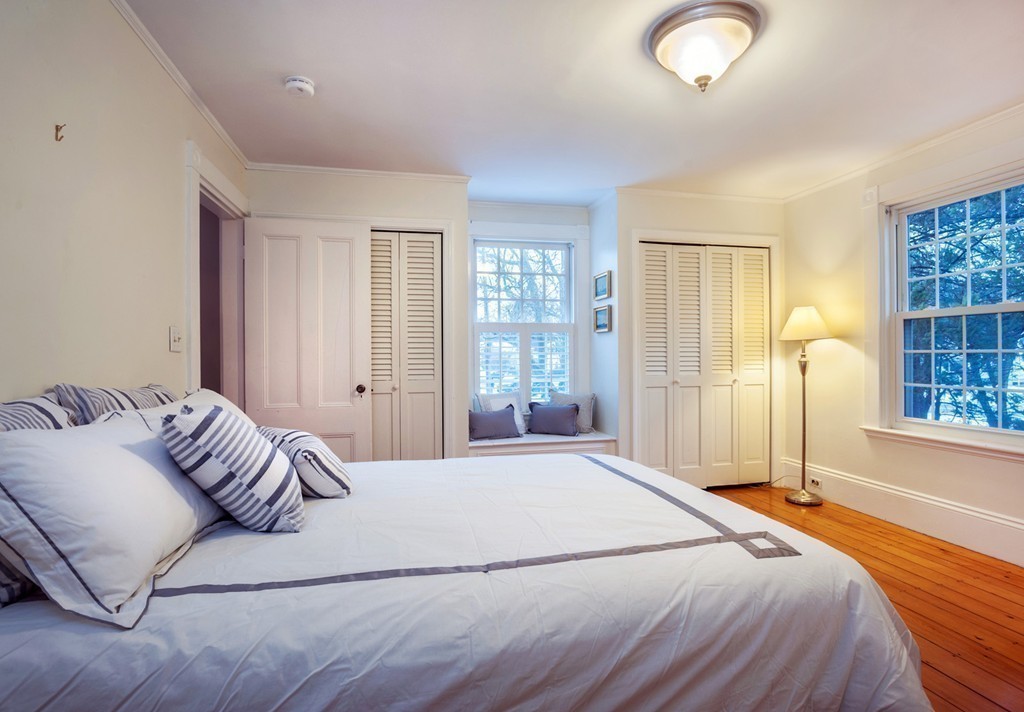 6 Leavitt Street Hingham, MA 02043 - Photo 17 of 28 a bedroom with a large bed and a window