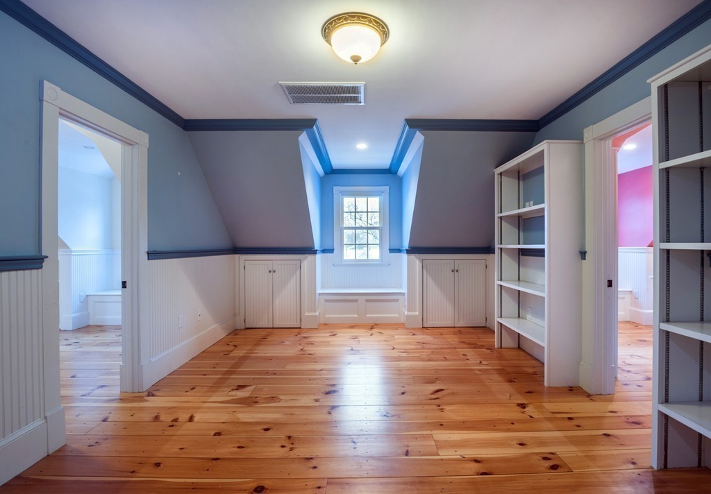 6 Leavitt Street Hingham, MA 02043 - Photo 19 of 28 a view of a living room with wooden floor and staircase