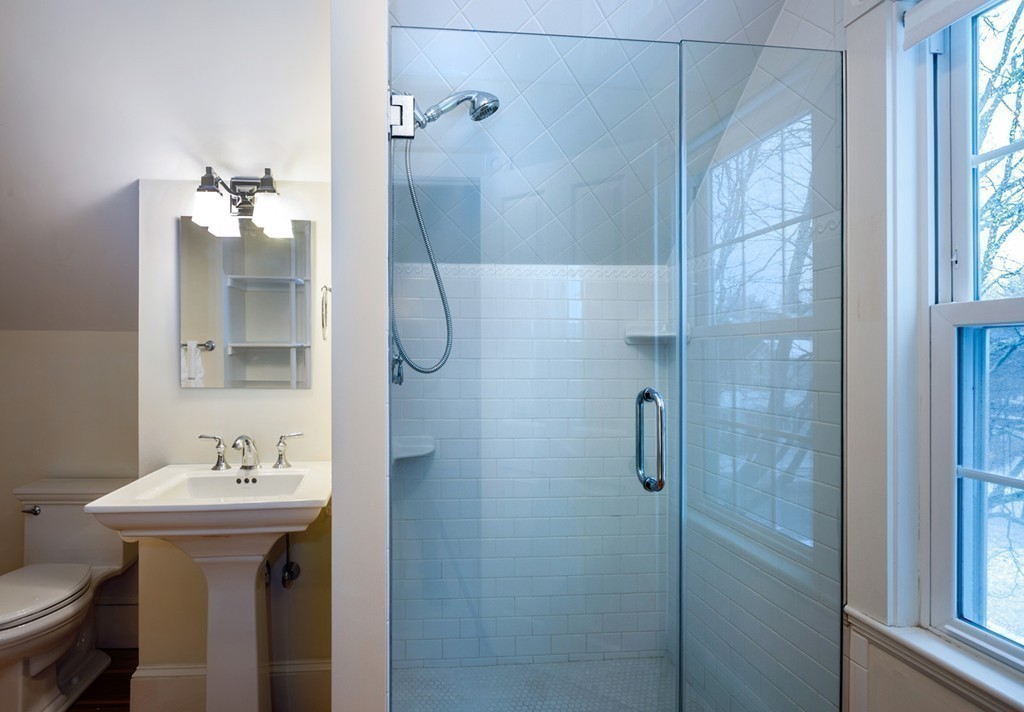 6 Leavitt Street Hingham, MA 02043 - Photo 21 of 28 a bathroom with a sink toilet and shower