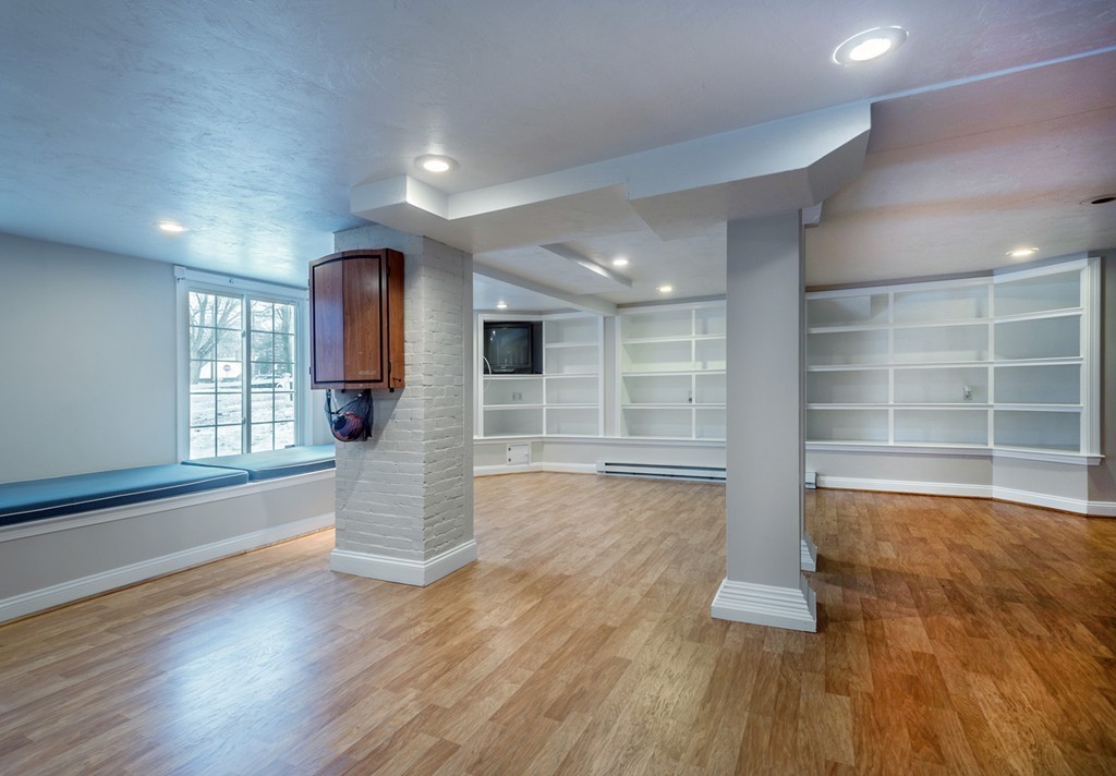6 Leavitt Street Hingham, MA 02043 - Photo 23 of 28 a view of empty room with wooden floor and windows
