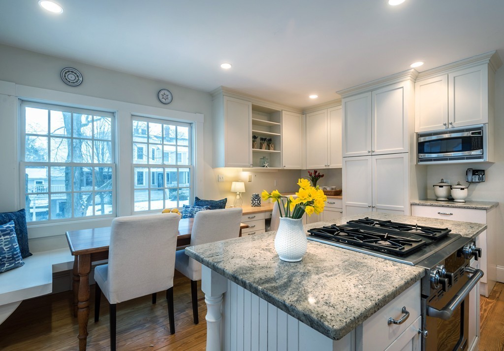 6 Leavitt Street Hingham, MA 02043 - Photo 5 of 28 a kitchen with a stove a table and chairs in it