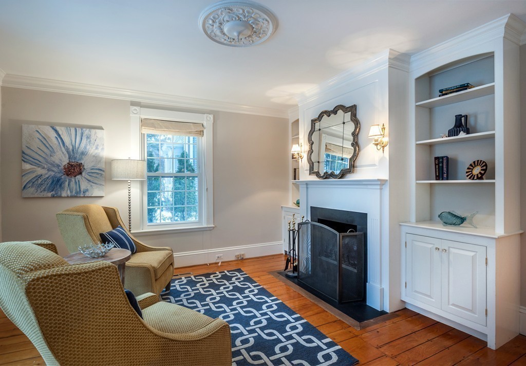 6 Leavitt Street Hingham, MA 02043 - Photo 10 of 28 a living room with furniture and a fireplace