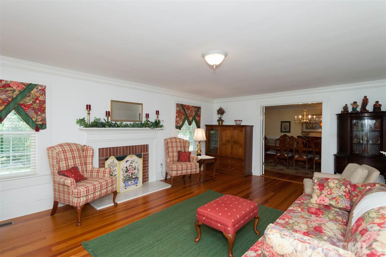 365 Rassie Crabtree Road Rougemont, NC 27572 - Photo 8 of 25 a living room with furniture and a fireplace