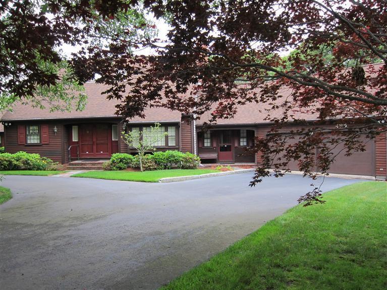 495 Elliott Road Centerville, MA 02632 - Photo 1 of 17 a front view of a house with a garden and yard