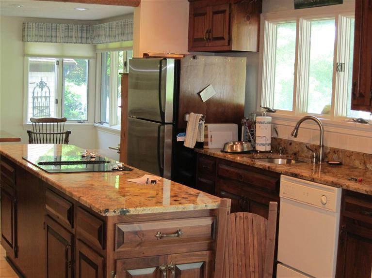 495 Elliott Road Centerville, MA 02632 - Photo 11 of 17 a kitchen with a sink a refrigerator and window