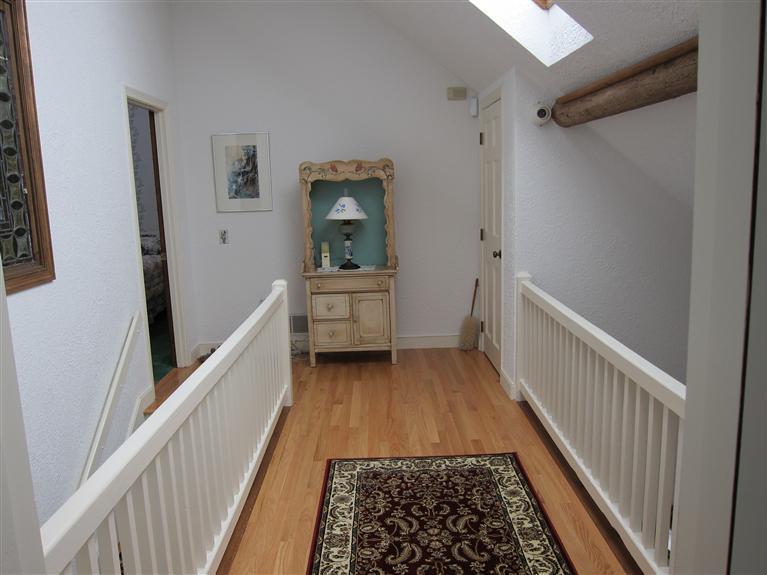 495 Elliott Road Centerville, MA 02632 - Photo 13 of 17 a view of a hallway with wooden floor and furniture