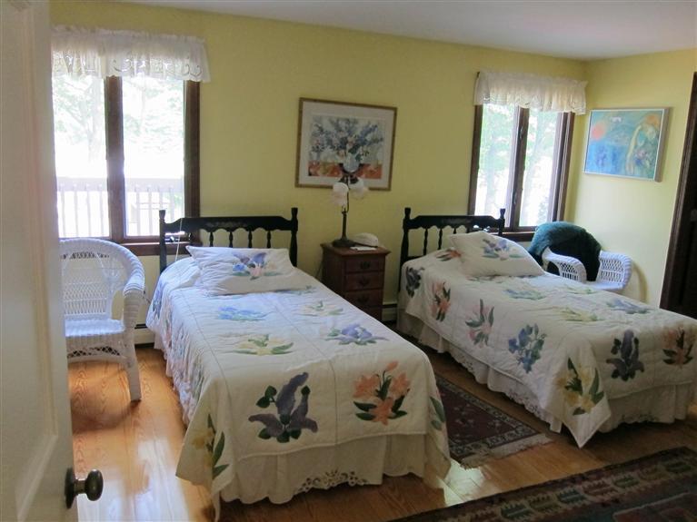 495 Elliott Road Centerville, MA 02632 - Photo 14 of 17 a bedroom with two beds and painting on the wall