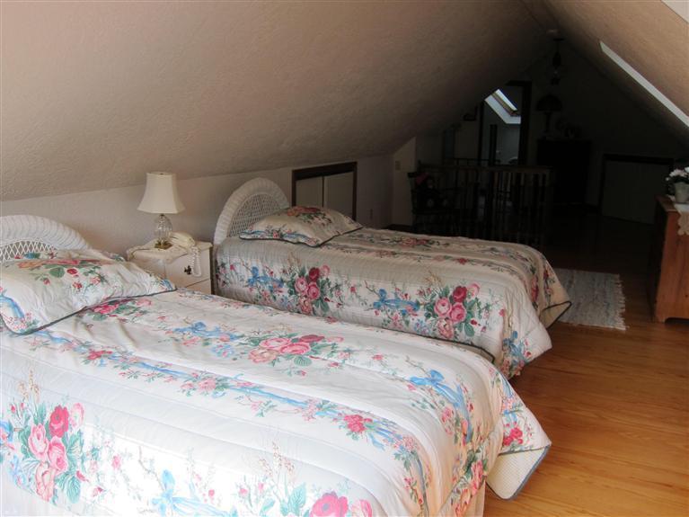 495 Elliott Road Centerville, MA 02632 - Photo 15 of 17 a bedroom with a bed and a lamp on dresser