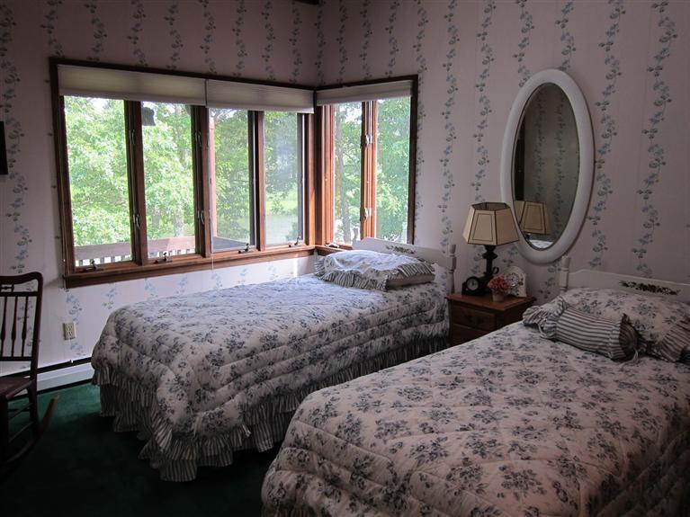 495 Elliott Road Centerville, MA 02632 - Photo 16 of 17 a bedroom with two beds and large windows
