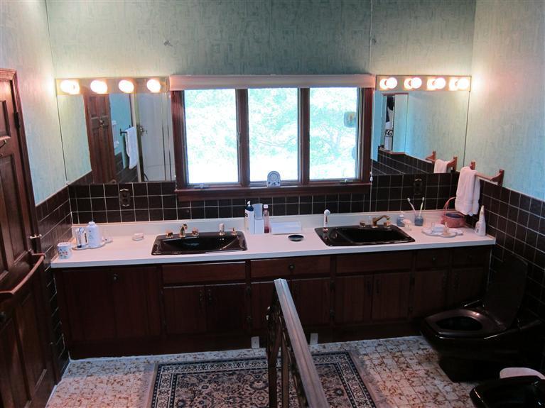 495 Elliott Road Centerville, MA 02632 - Photo 17 of 17 a bathroom with a double vanity sink and a mirror