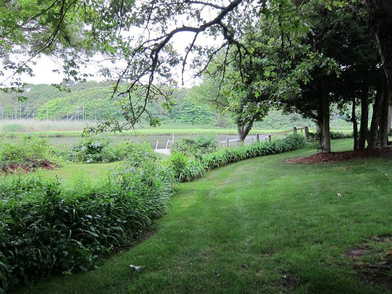 495 Elliott Road Centerville, MA 02632 - Photo 2 of 17 a view of a lush green space