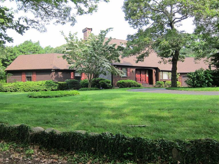 495 Elliott Road Centerville, MA 02632 - Photo 3 of 17 a front view of a house with a yard