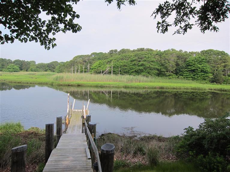 495 Elliott Road Centerville, MA 02632 - Photo 4 of 17 a view of a lake with a mountain in the background
