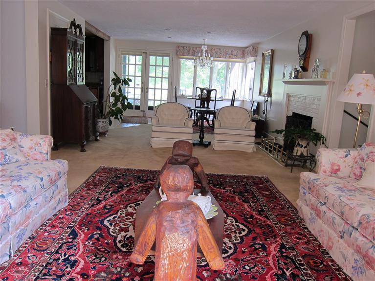 495 Elliott Road Centerville, MA 02632 - Photo 7 of 17 a living room with furniture and a fireplace