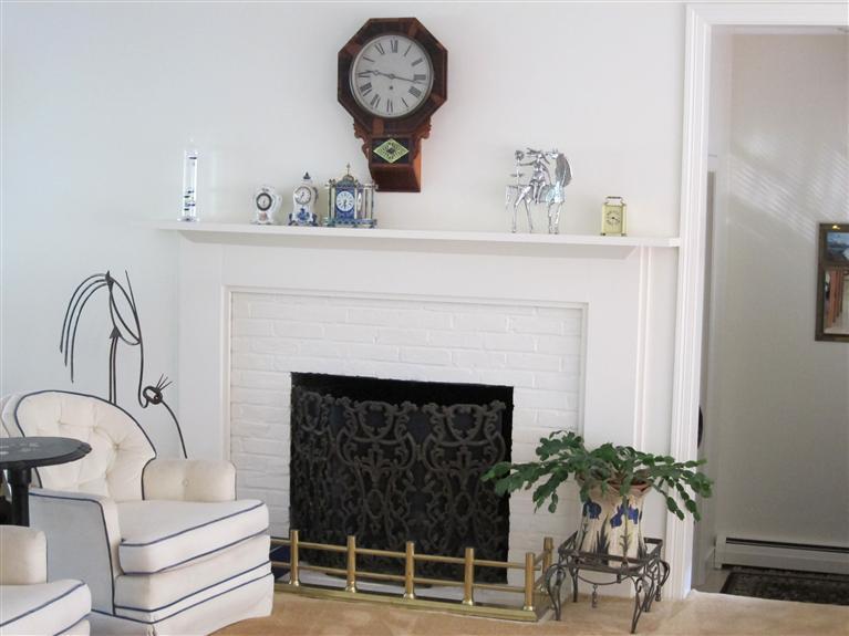 495 Elliott Road Centerville, MA 02632 - Photo 8 of 17 a living room with furniture and a fireplace